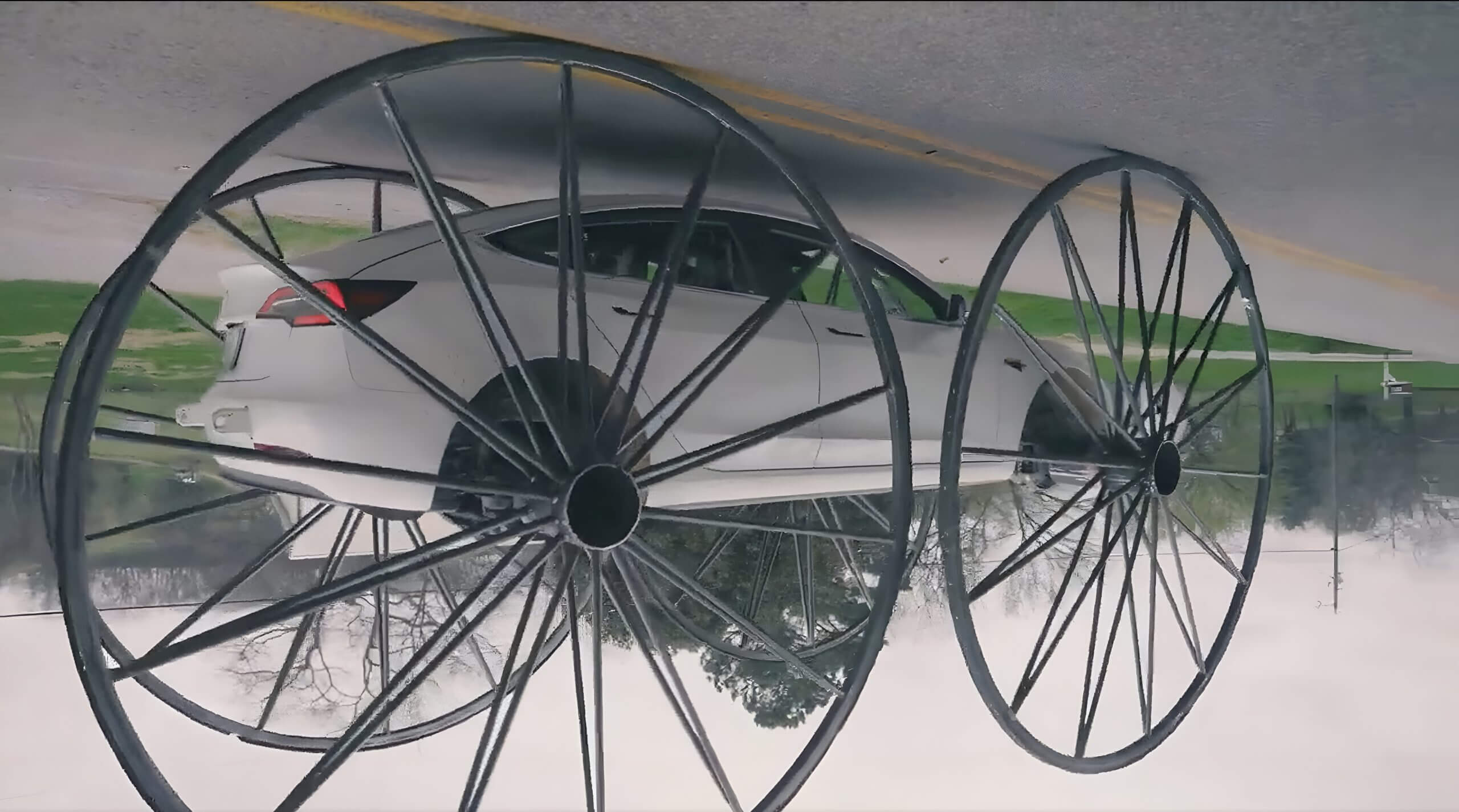 特斯拉 Model 3 在搞笑的新视频中配备了 10 英尺宽的车轮